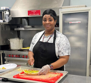 Chef Latasha in the kitchen cooking