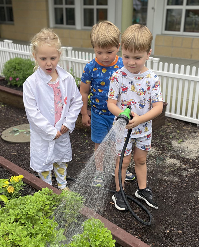 Children watering the garden